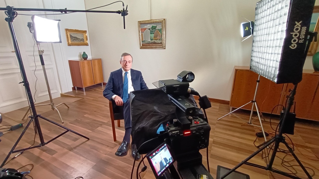 Mario Draghi seated for a live interview at the Bank of Italy, lit with a Godox softbox and framed on a Sony FX30, cinematography by Matteo Castelli